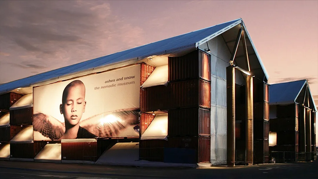 The Ashes and Snow exhibition space, exterior shot at night.