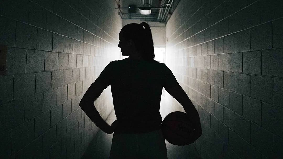 Silhouette of Caitlin Clark shot from behind.