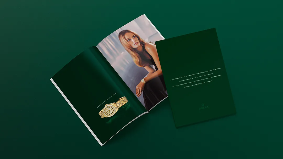 Rolex fashion magazine spread. Gold watch packshot with model wearing the watch.